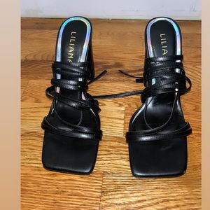 Black heels with strings that ties up. Very comfortable heels